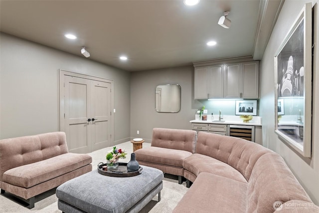 living room with baseboards, wine cooler, recessed lighting, wet bar, and carpet floors