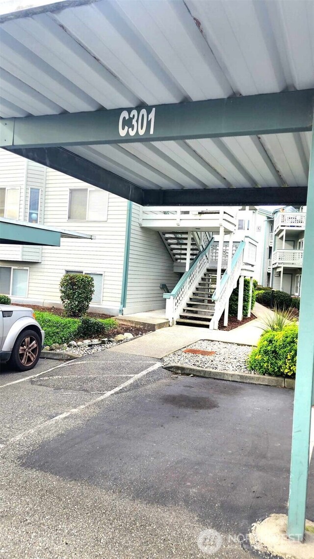 485 SW Bayshore Dr Unit C301, Oak Harbor, WA 98277 - view of vehicle parking with stairs