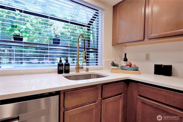 11500 NE 128th St Unit 48, Kirkland, WA 98034 - kitchen with a sink, light countertops, beverage cooler, and brown cabinets