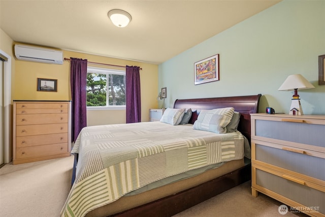 bedroom with carpet and a wall mounted air conditioner