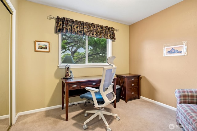 office featuring light colored carpet and baseboards