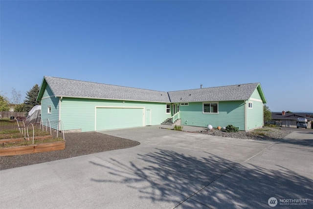 305 W Eunice St, Sequim, WA 98382 - single story home featuring a shingled roof, driveway, an attached garage, and a garden