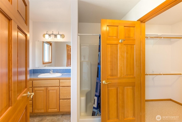 305 W Eunice St, Sequim, WA 98382 - full bathroom with a walk in closet, a shower with shower curtain, and vanity