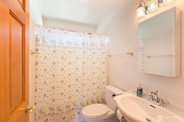 305 W Eunice St, Sequim, WA 98382 - bathroom featuring toilet, a sink, and a shower with shower curtain