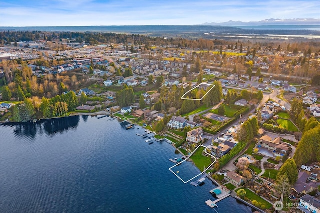 bird's eye view featuring a residential view and a water and mountain view
