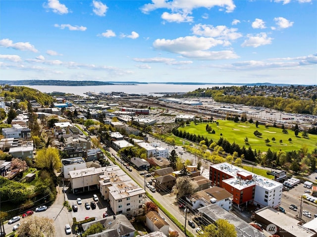 aerial view featuring view of golf course and a water view