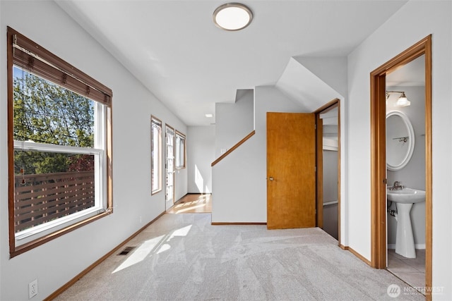 bonus room with carpet floors, visible vents, and baseboards