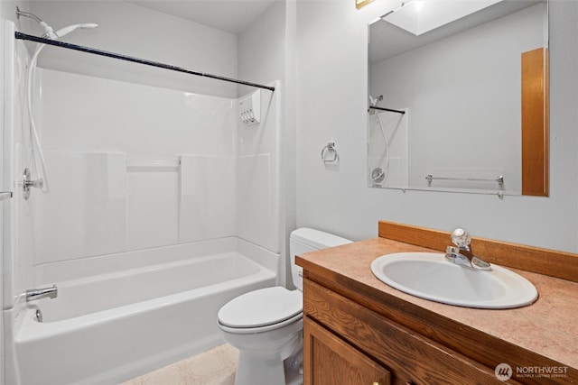 full bath with vanity, shower / tub combination, and toilet