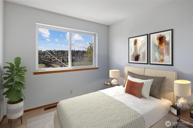 bedroom featuring visible vents and baseboards