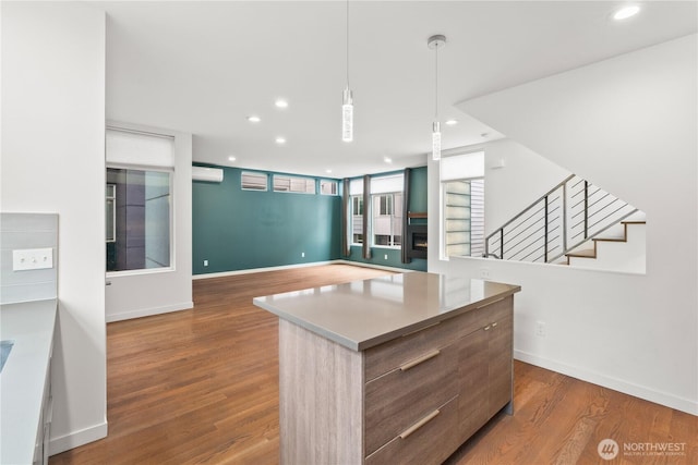 2620 SW Nevada St, Seattle, WA 98126 - kitchen featuring decorative light fixtures, wood finished floors, baseboards, and recessed lighting