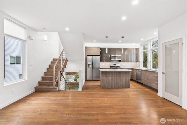 2620 SW Nevada St, Seattle, WA 98126 - kitchen with a center island, recessed lighting, modern cabinets, and stainless steel appliances