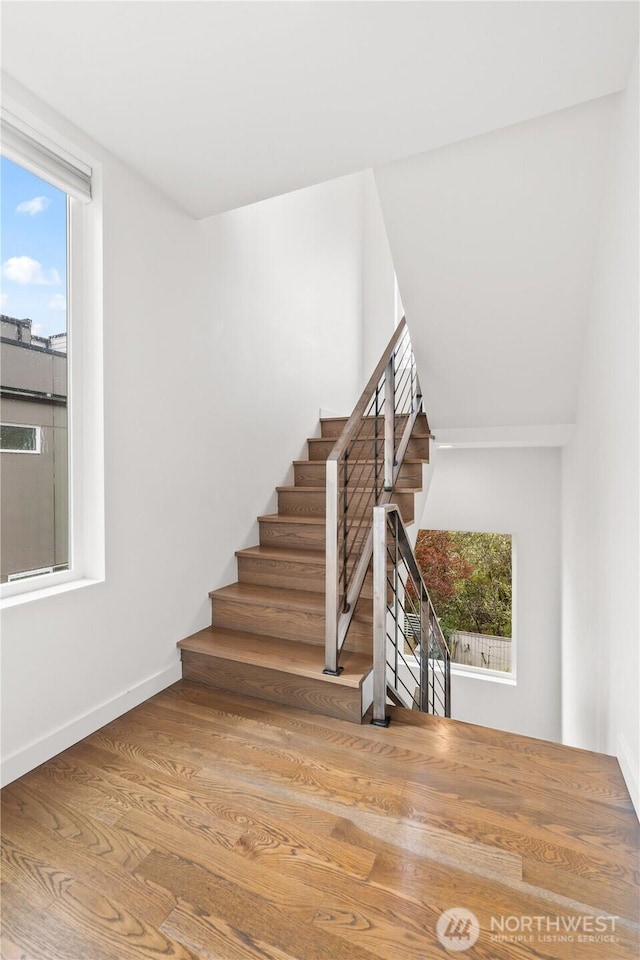 2620 SW Nevada St, Seattle, WA 98126 - staircase with baseboards and wood finished floors