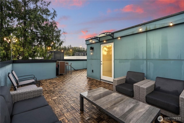 2620 SW Nevada St, Seattle, WA 98126 - patio terrace at dusk with an outdoor hangout area