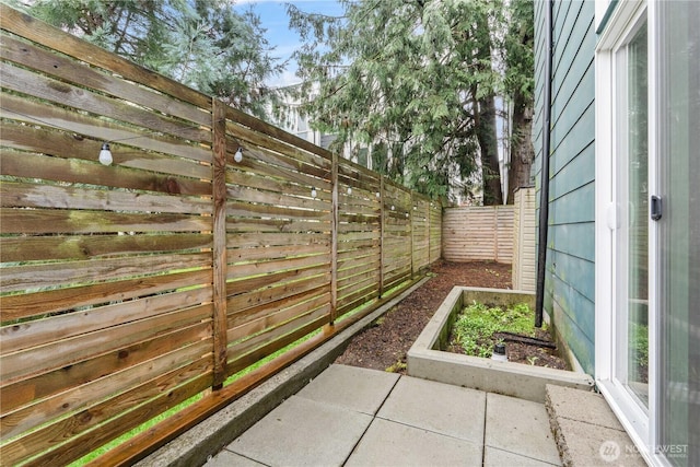 2620 SW Nevada St, Seattle, WA 98126 - view of yard with a fenced backyard and a garden