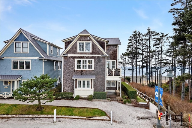 78 Pacifica Ln, Pacific Beach, WA 98571 - shingle-style home featuring a balcony, a standing seam roof, and metal roof