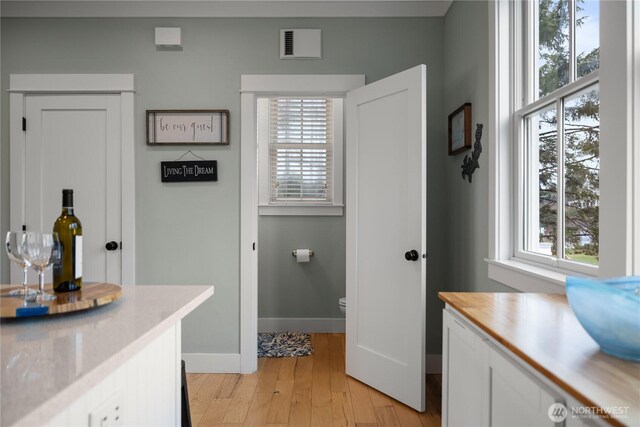 78 Pacifica Ln, Pacific Beach, WA 98571 - bathroom featuring visible vents, baseboards, wood finished floors, toilet, and vanity