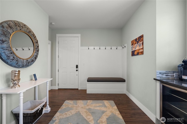 78 Pacifica Ln, Pacific Beach, WA 98571 - mudroom with dark wood-style floors, baseboards, and beverage cooler