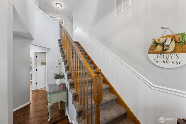 31000 186th Pl SE, Covington, WA 98042 - stairs featuring a wainscoted wall, a towering ceiling, visible vents, and wood finished floors