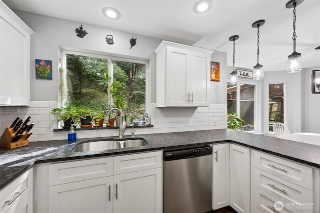 31000 186th Pl SE, Covington, WA 98042 - kitchen featuring stainless steel dishwasher, white cabinets, dark stone countertops, and a sink