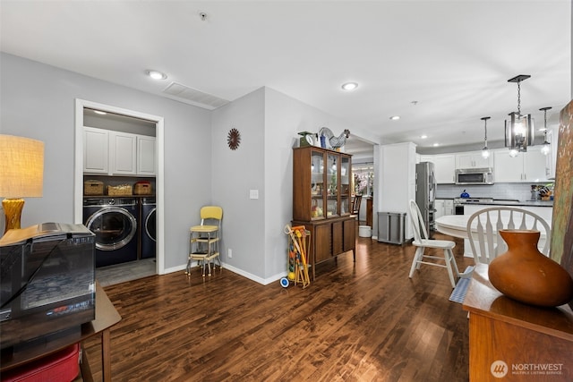 31000 186th Pl SE, Covington, WA 98042 - living area featuring dark wood-style floors, recessed lighting, washing machine and clothes dryer, and baseboards
