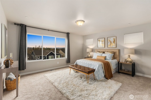 bedroom with carpet flooring, baseboards, and visible vents