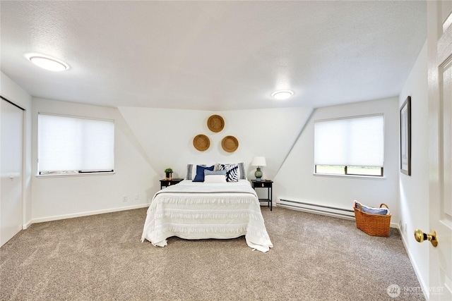 6455 NE Brigham Rd, Bainbridge Island, WA 98110 - carpeted bedroom with a baseboard heating unit, a textured ceiling, and baseboards