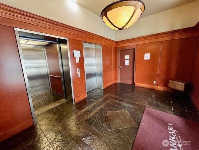 123 Queen Anne Ave N Unit 405, Seattle, WA 98109 - entryway featuring lofted ceiling and elevator