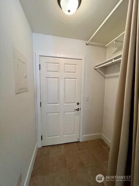 123 Queen Anne Ave N Unit 405, Seattle, WA 98109 - walk in closet featuring tile patterned floors and electric panel