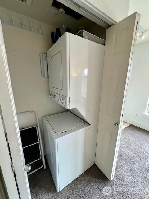 123 Queen Anne Ave N Unit 405, Seattle, WA 98109 - laundry area with carpet flooring, laundry area, and stacked washer / drying machine