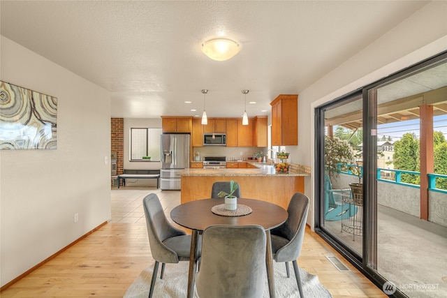 5510 3rd Ave NW, Seattle, WA 98107 - dining room featuring light wood-type flooring, baseboards, and recessed lighting
