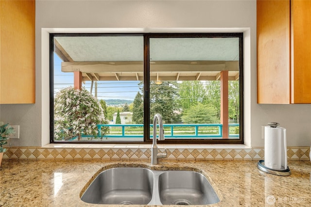 5510 3rd Ave NW, Seattle, WA 98107 - kitchen with a sink, backsplash, and light stone counters