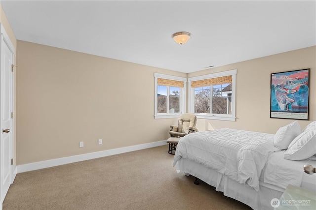 carpeted bedroom with baseboards