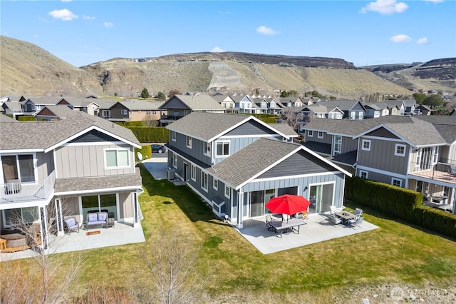 bird's eye view with a residential view and a mountain view