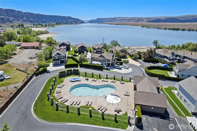 aerial view featuring a residential view and a water view