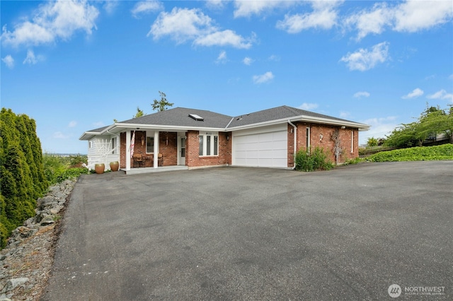 822 SW Fairhaven Ave, Oak Harbor, WA 98277 - single story home featuring driveway, brick siding, an attached garage, and covered porch