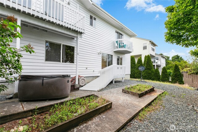 822 SW Fairhaven Ave, Oak Harbor, WA 98277 - back of property featuring a balcony and a vegetable garden