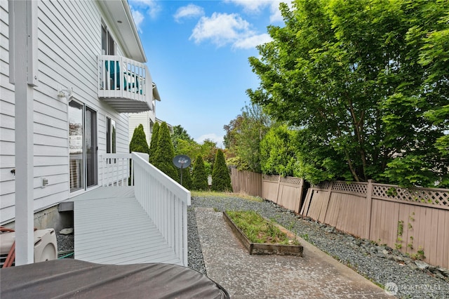 822 SW Fairhaven Ave, Oak Harbor, WA 98277 - view of yard featuring a balcony, a garden, and a patio
