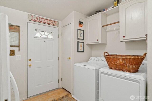 24502 Saddle St, Leavenworth, WA 98826 - clothes washing area with cabinet space, independent washer and dryer, and light wood-type flooring