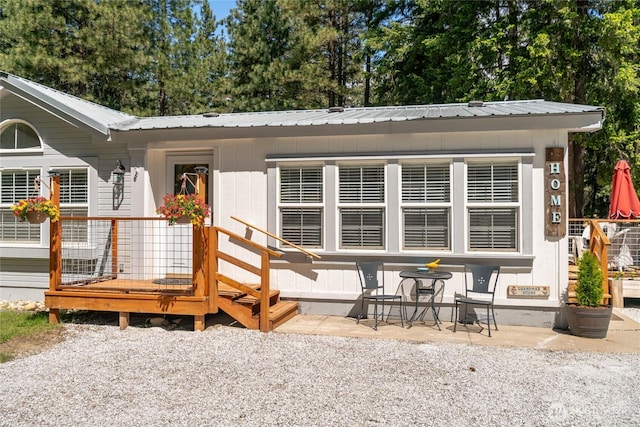 24502 Saddle St, Leavenworth, WA 98826 - property entrance with a patio and metal roof