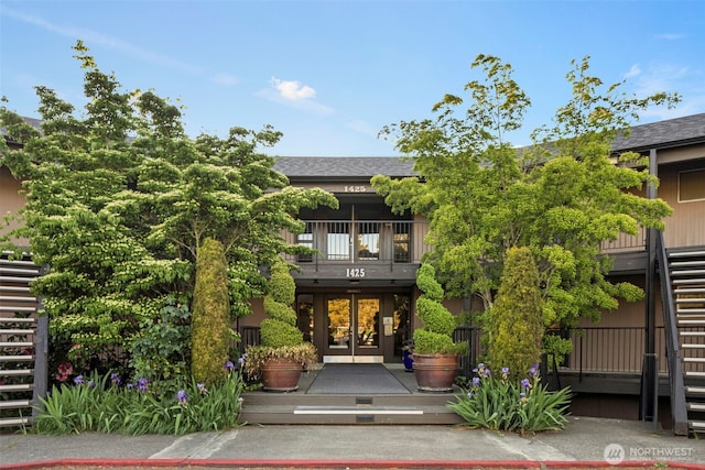 1425 S Puget Dr Unit 213, Renton, WA 98055 - exterior space with a balcony, french doors, and roof with shingles