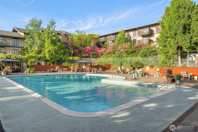 1425 S Puget Dr Unit 213, Renton, WA 98055 - community pool with fence, a gazebo, and a patio