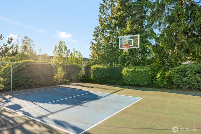 1425 S Puget Dr Unit 213, Renton, WA 98055 - view of basketball court featuring basketball hoop and fence