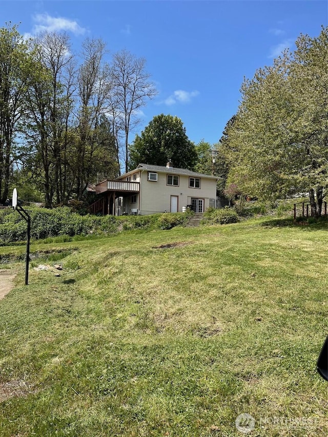 view of yard with a wooden deck