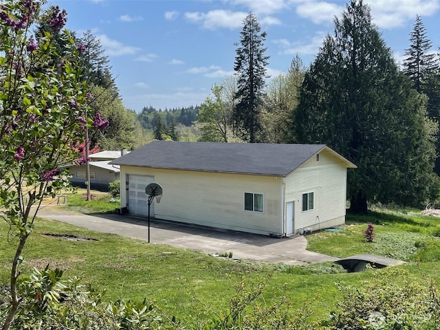 garage with concrete driveway