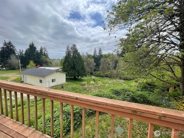 wooden deck with a yard