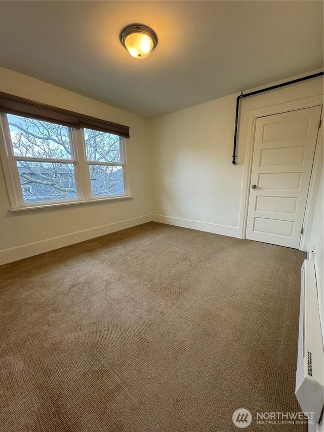 261 E Boston St, Seattle, WA 98102 - carpeted spare room featuring baseboards