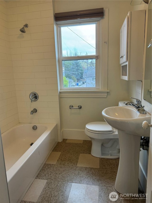 261 E Boston St, Seattle, WA 98102 - bathroom with baseboards, toilet, and shower / washtub combination