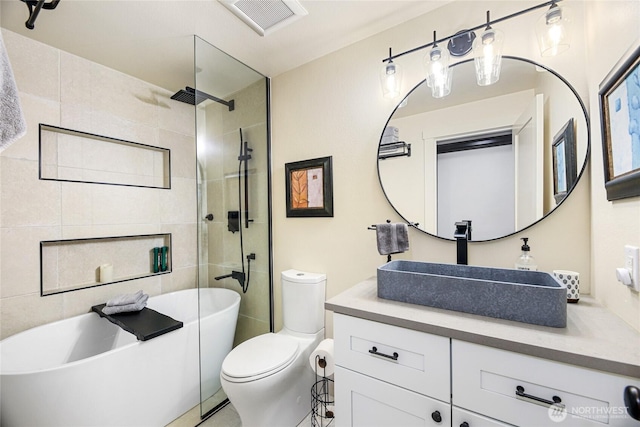full bathroom with a tile shower, toilet, a soaking tub, and vanity