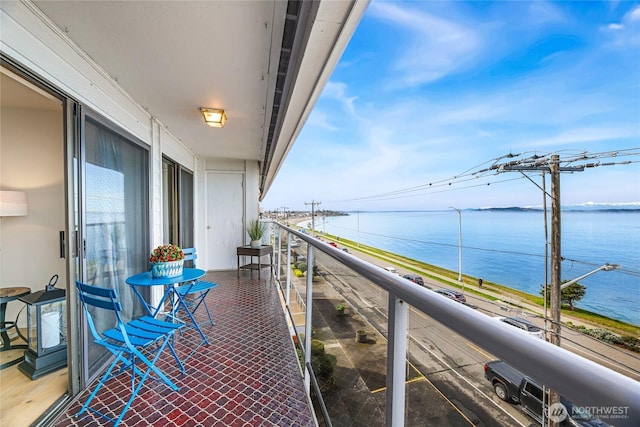 balcony featuring a water view