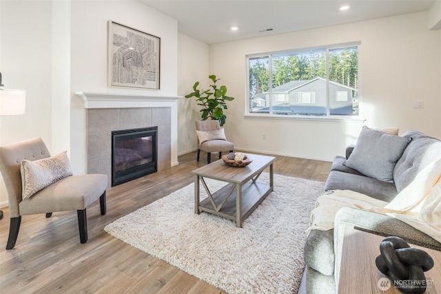 33140 Glacier Ave SE, Black Diamond, WA 98010 - living area with baseboards, recessed lighting, wood finished floors, and a tiled fireplace